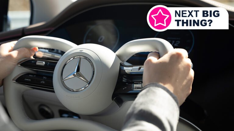 Two hands holding a steering wheel with Mercedes-Benz steer-by-wire tech