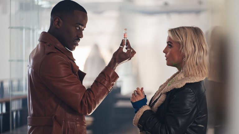 The Doctor holding a needle and standing next to Ruby in Doctor Who season 2