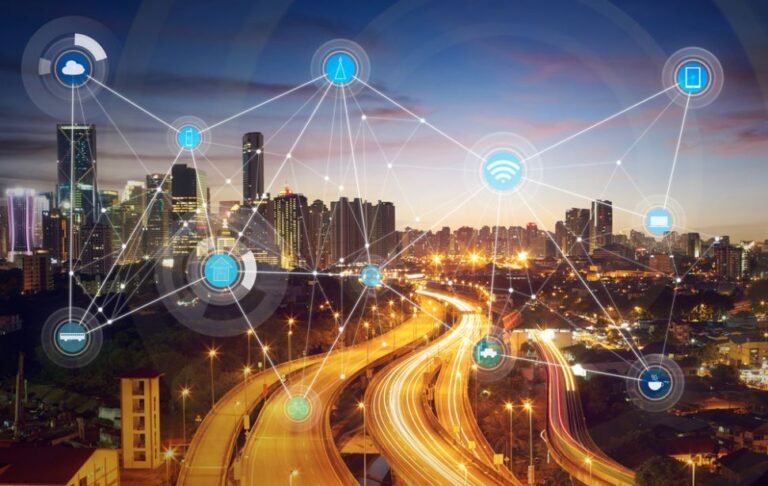 A smart city graphic: a city with digital symbols connecting over it.